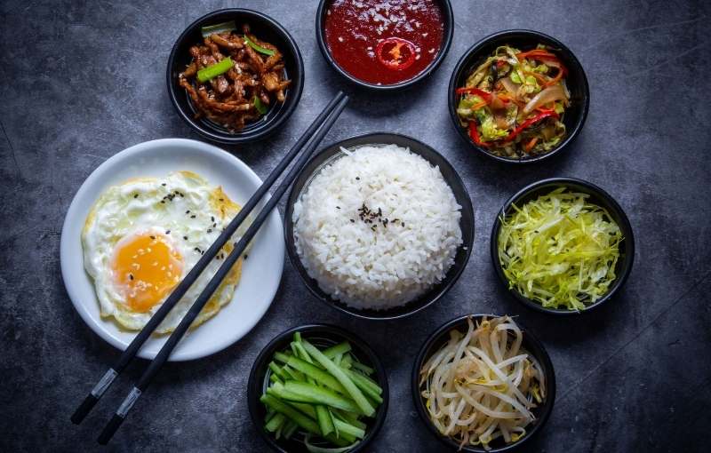 Rice with chinese vegetables and fried egg