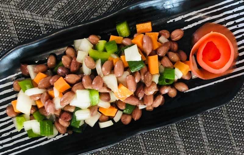 Spiced Peanuts with garnished vegetables chinese dish